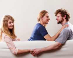 Handsome Man Betrayed Women Betrayal and infidelity concept. Handsome boy with two attractive blondie girls. Man cheating women by mislead chosen one and flirting with another female.